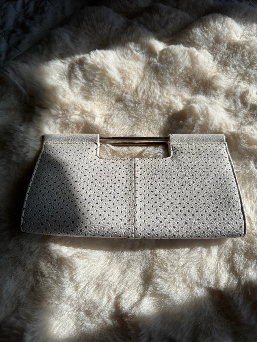 The Limited Cream Perforated Clutch with Gold-Tone Handle